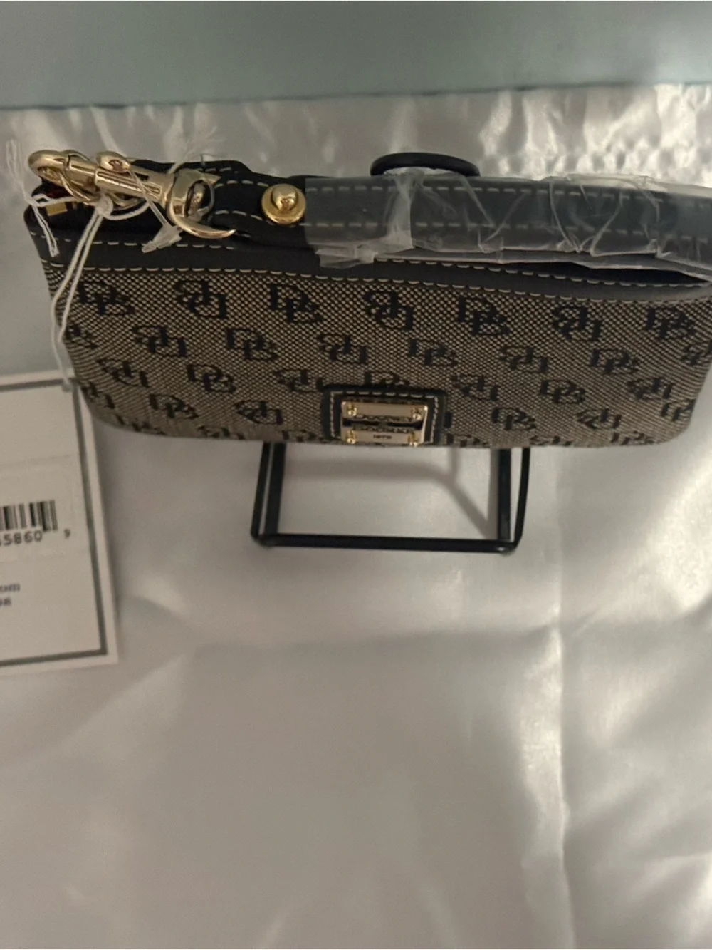 Dooney and Bourke NWT Medium logo wristlet. Comes in a box!